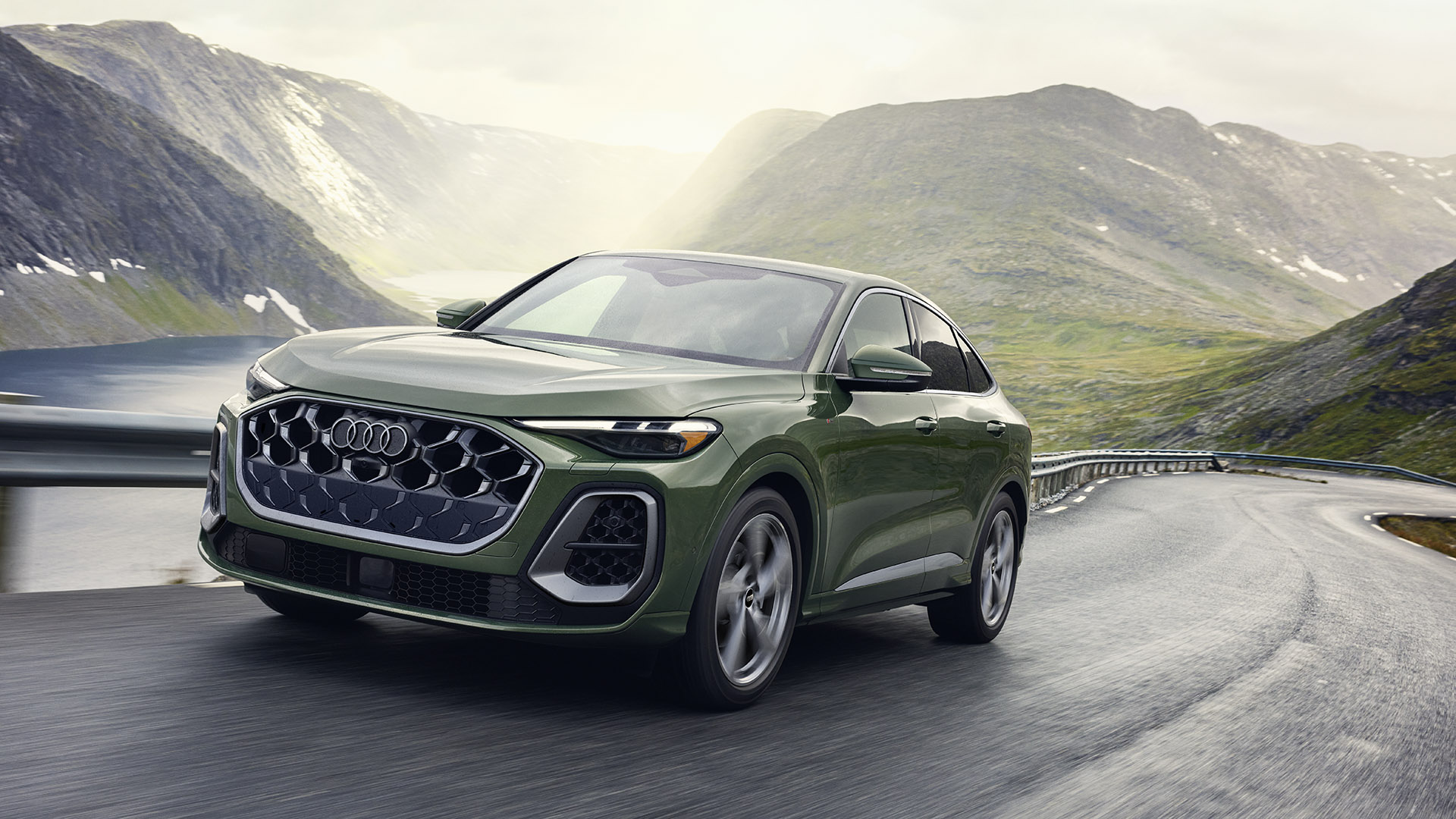 Transform Your Vehicle with Paintless Dent Repair in Denver | 2025 Audi Q5 Sportback driving on a mountain road.